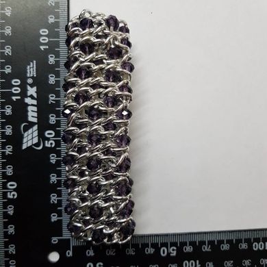 Браслет в п'ять рядів на гумці з намистинами з кришталю діаметром 6 мм, довжина обхвату близько 18 см, колір фіолетовий з сріблом